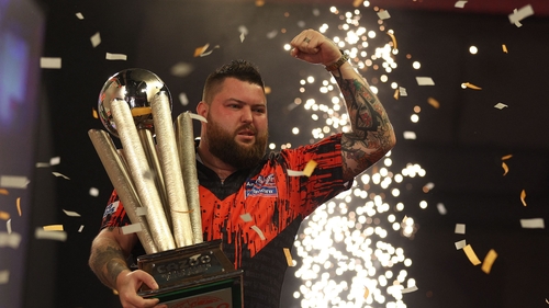 Michael Smith clutches the Sid Waddell Trophy