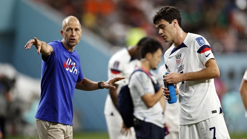 Gregg Berhalter issues instructions during the USA's World Cup clash with the Netherlands, while Gio Reyna takes a water break