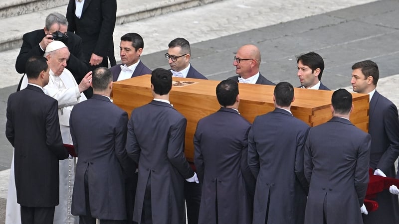 Pope Francis blesses the coffin of Pope Emeritus Benedict XVI during his funeral mass at St Peter's square in the Vatican