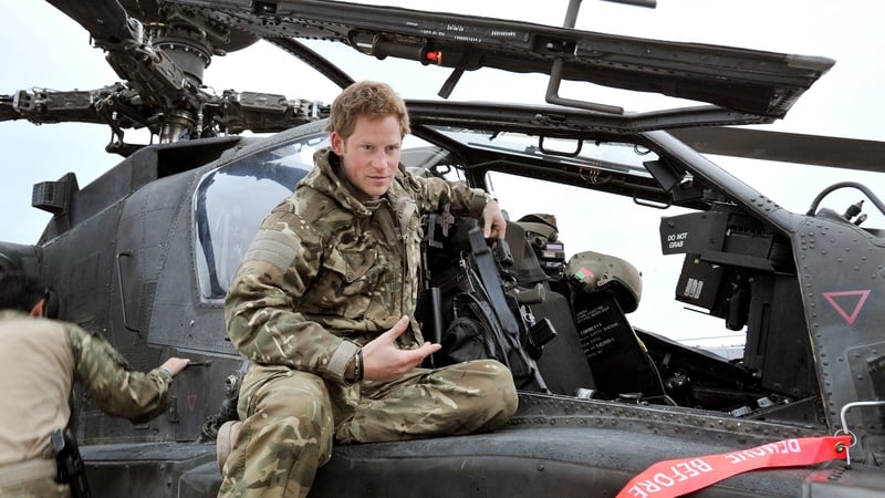Prince Harry makes early morning checks at an Apache helicopter at Camp Bastion on 12 December 2012 in Afghanistan