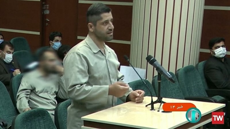 Seyyed Mohammad Hosseini speaks in a courtroom before being executed by hanging