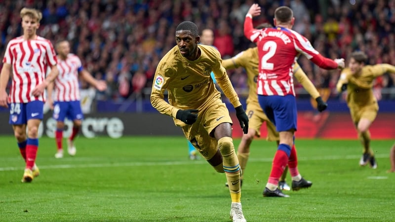 Ousmane Dembele wheels away in celebration