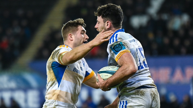 Hugo Keenan celebrates his try against Ospreys with Jordan Larmour