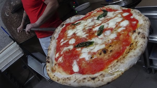 Neapolitan pizza maker Ciro Rapuano prepares a pizza Margherita, in a Naples' restaurant. Photo: Salvatore Laporta/Kontrolab/LightRocket via Getty Images