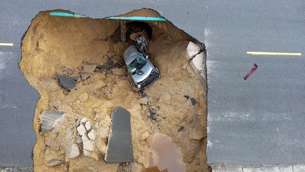 Two cars were swallowed by a sinkhole in southern California