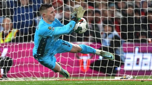 Dean Henderson saves a spot-kick from Ruben Neves