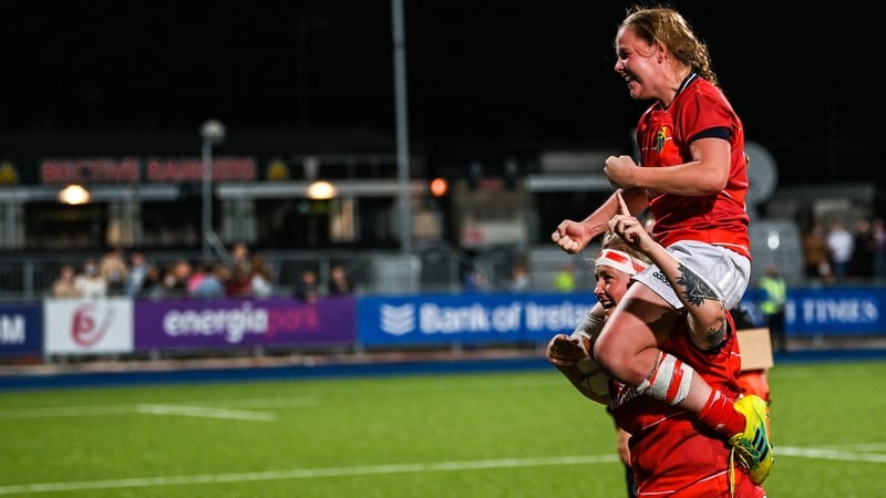 Sheehan lifts out-half Nicole Cronin over her shoulders after winning the 2021 title