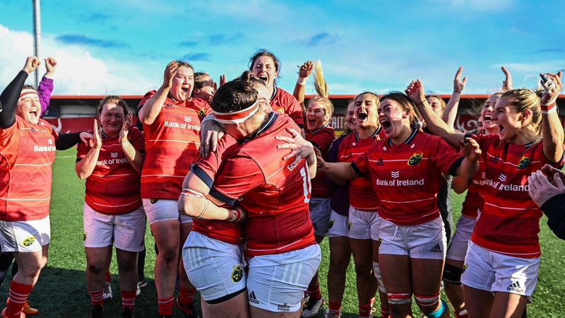 Chloe Pearse of Munster, right, after being proposed to by partner and teammate Clodagh O'Halloran, left, following the win