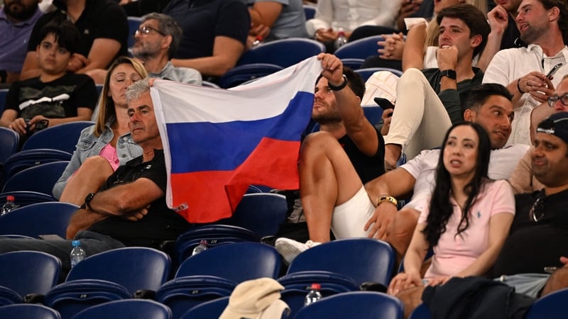 A supporter holds a flag of Russia at the Australian Open