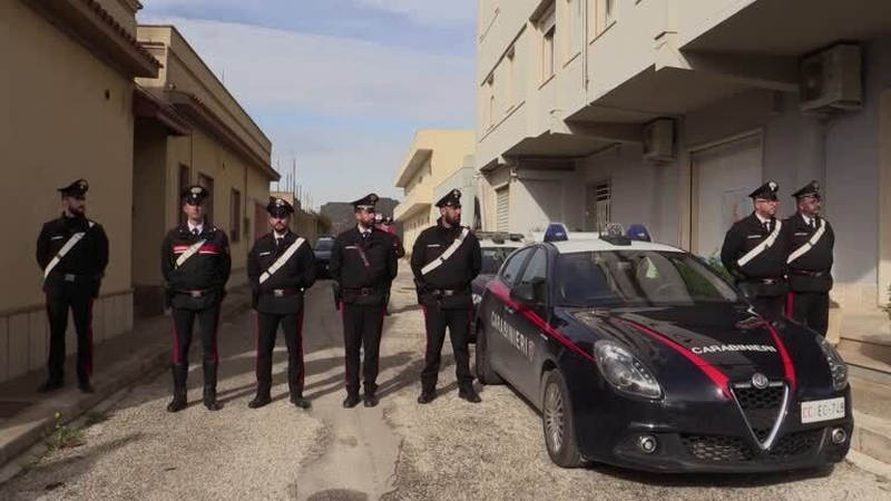 Police outside the apartment in the small town of Campobello di Mazara