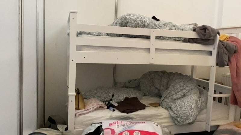 The disused church and adjacent building have been partitioned into cubicles with bunks