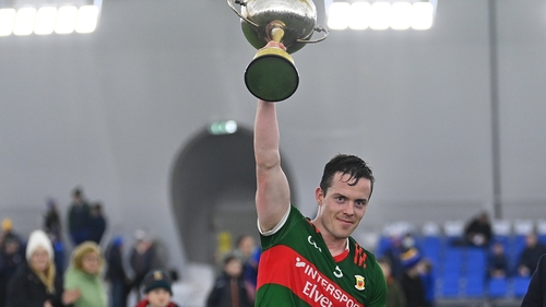 Mayo captain Stephen Coen lifts the cup