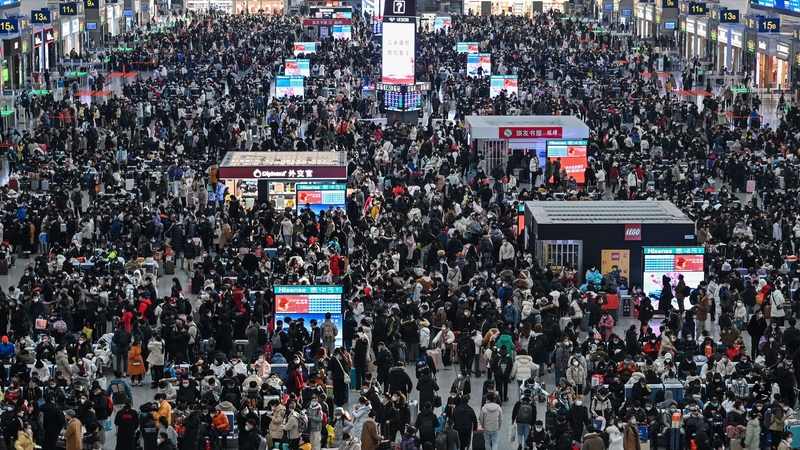 Passengers wait for their train at Hongqiao railway station in Shanghai as annual migration begins with people heading back to their hometowns for Lunar New Year celebrations