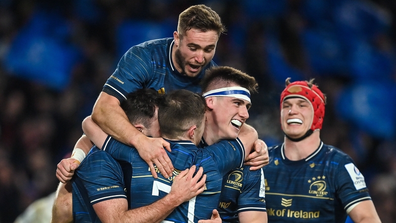 Leinster players celebrate their second try of the game, scored by Hugo Keenan