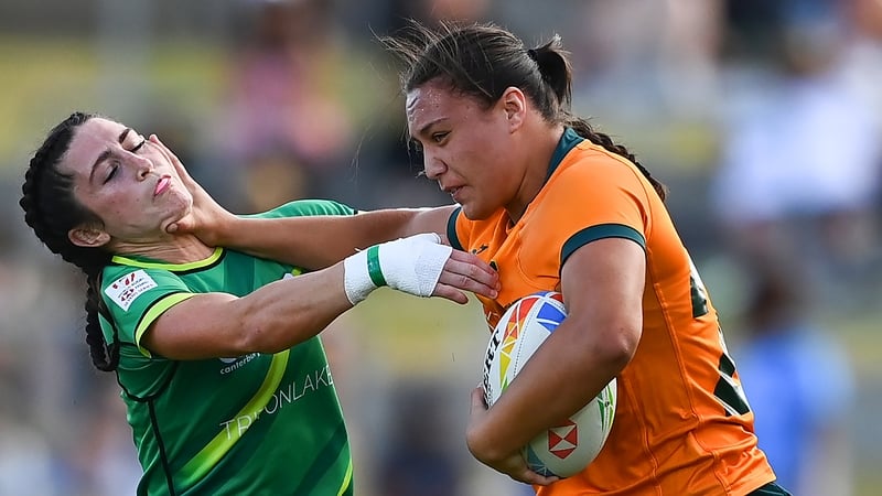 Bienne Terita of Australia fends off a tackle from Amee Leigh Murphy Crowe
