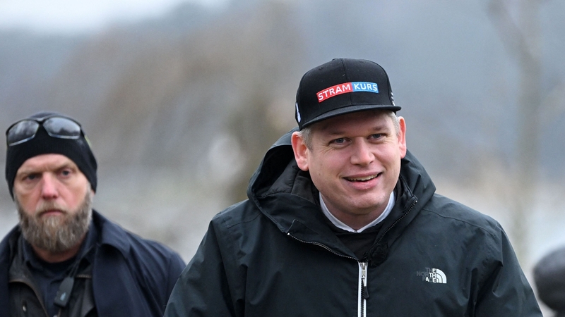 Far-right politician Rasmus Paludan (R) set fire to a copy of the Muslim holy book in front of Turkey's embassy