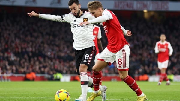 Bruno Fernandes of Manchester United battles for possession with Martin Odegaard