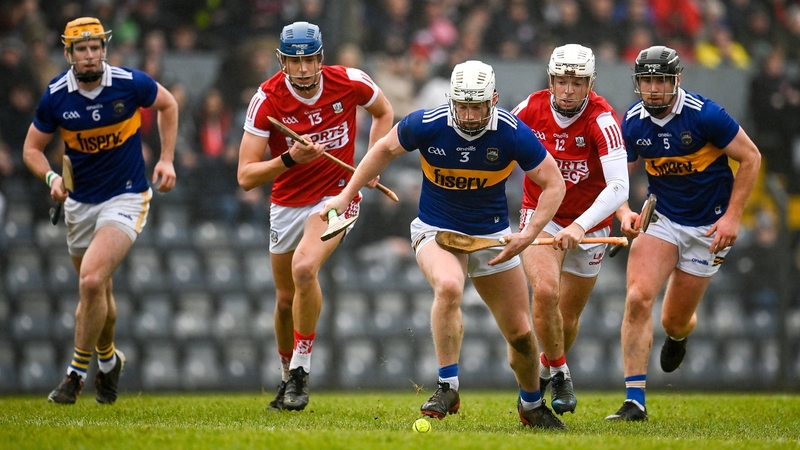 Michael Breen of Tipperary under pressure from Cork's Luke Meade