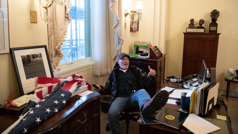 Richard Barnett with his feet on Nancy Pelosi's desk during the 6 January Capitol riots