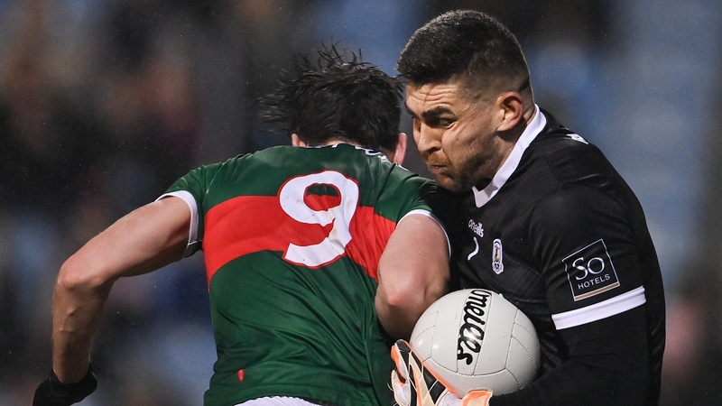 Galway goalkeeper Connor Gleeson is challenged by Mayo's Diarmuid O'Connor