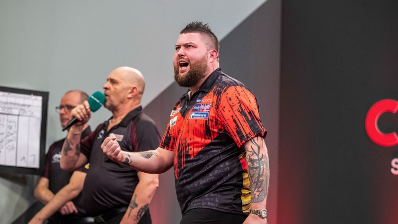 PDC world champion Michael Smith defeated another Smith to progress Credit: Taylor Lanning/PDC