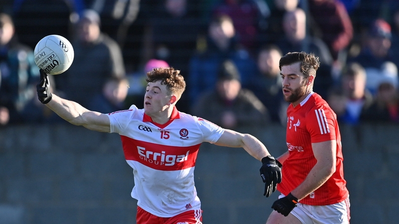 Derry's Lachlan Murray in action against Louth's Dermot Campbell