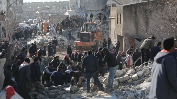 People search for survivors after buildings collapsed in Aleppo