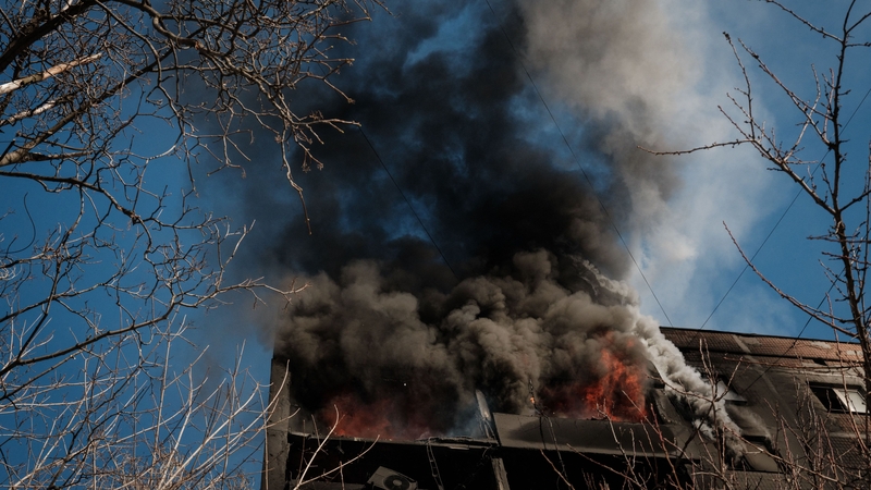 Part of the building on fire after shelling in the frontline city of Avdiivka