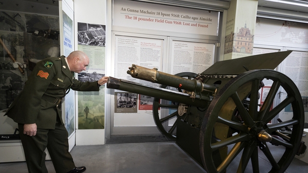Sgt Robbie Delaney inspects the field gun which he restored at the National Museum of Ireland