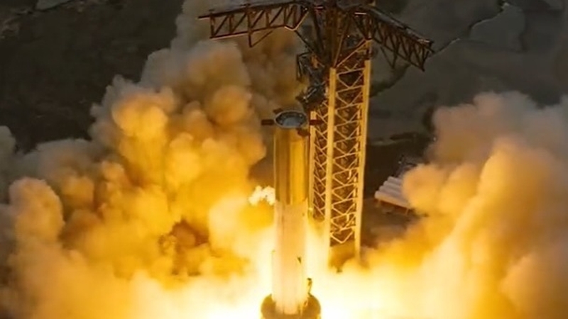 The test, called a static fire, of the 33 Raptor engines on the first-stage booster of SpaceX's Starship took place at the private space company's base in Texas (Credit: @SpaceX)