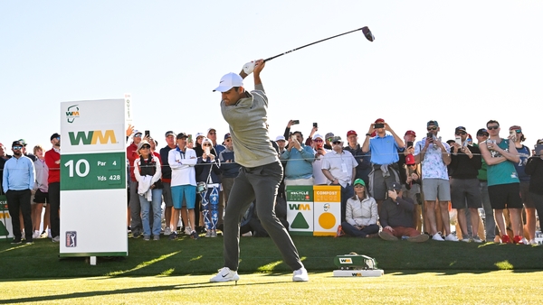 Scottie Scheffler plays his tee shot on the 10th hole at TPC Scottsdale