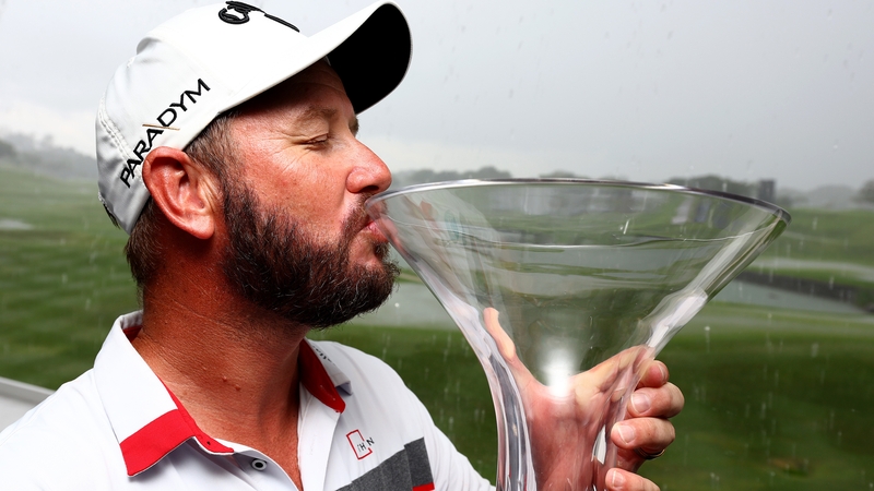 Ockie Strydom kisses the Singapore Classic trophy