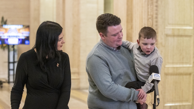 Daithi MacGabhann and his parents at Stormont this morning