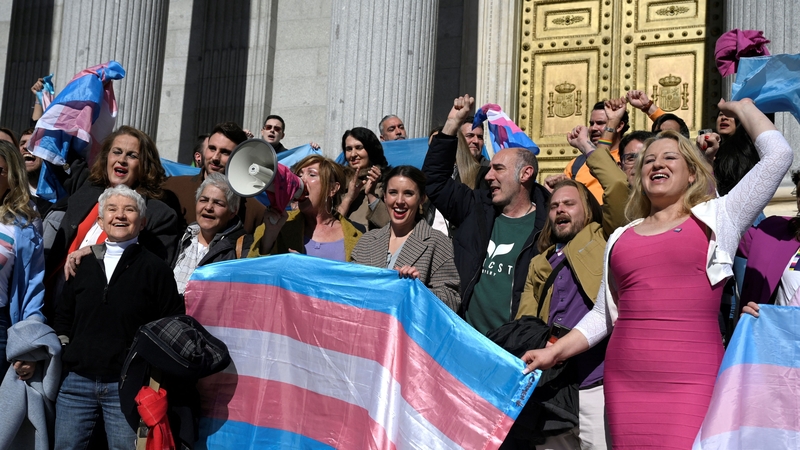 Carla Antonelli (L) Boti Garcia (2L), Spain's LGTBI+ President Uge Sangil (3L), Spain's Minister for Equality Irene Montero (C) and LGTBI+ member Niurka Gibaja (R) celebrate in front of the Spanish Congress