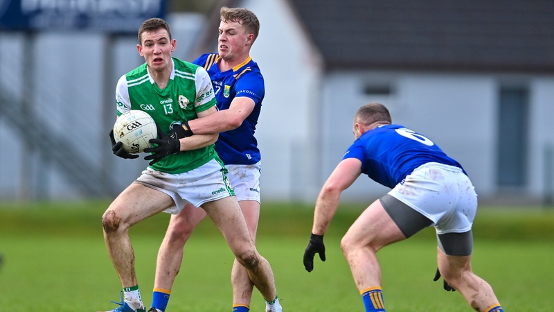 Joseph McGill of London in action against Zach Cullen and Eoin Murtagh of Wicklow