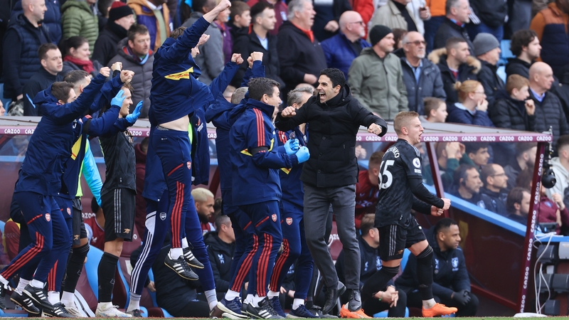 Mikel Arteta and his backroom team react to the final whistle at Villa Park