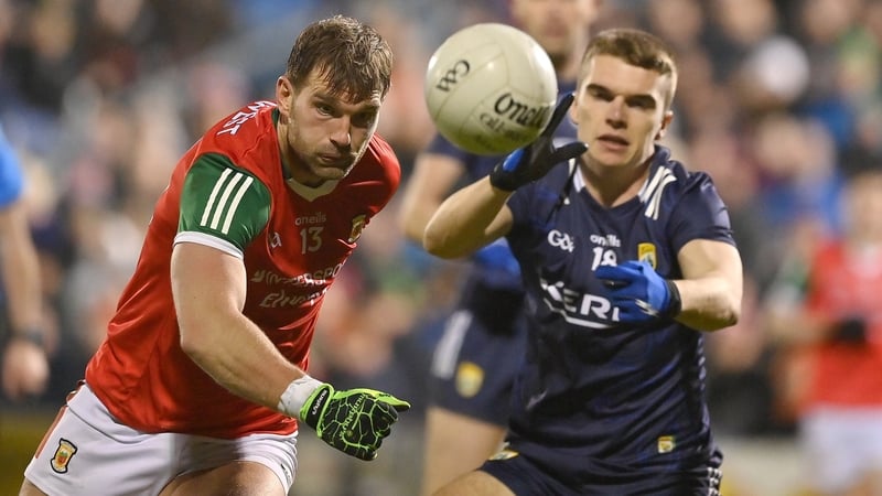 Aidan O'Shea wins possession ahead of Kerry defender Dylan Casey