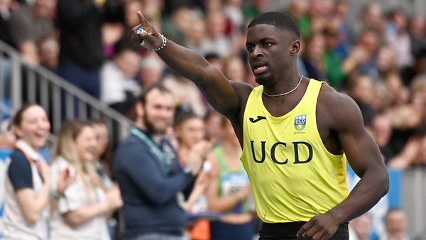 Israel Olatunde celebrates after landing the indoor 60m title with a national record time