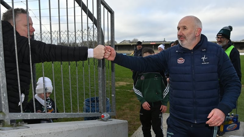 Kildare manager Glenn Ryan (R) right, is congratulated by supporter Darren Clinton