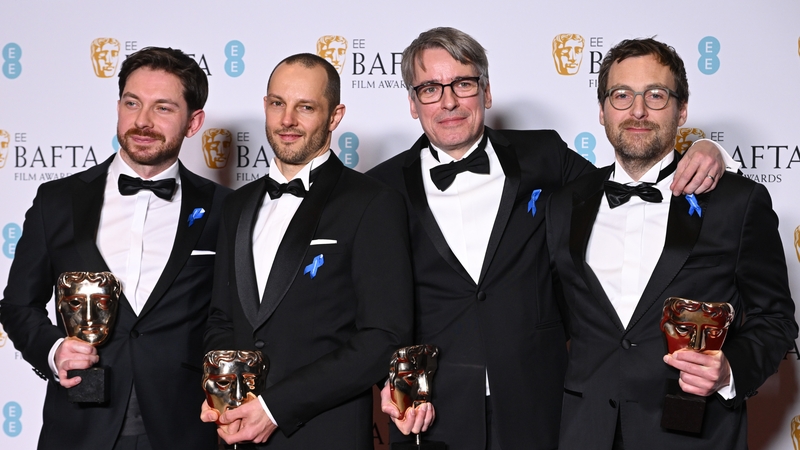 Viktor Prasil, Markus Stemler, Frank Kruse and Lars Ginzel poses with their awards for All Quiet on the Western Front