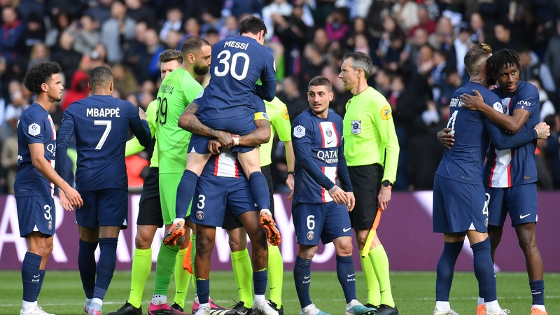 Lionel Messi celebrates his winning free-kick with PSG team-mates