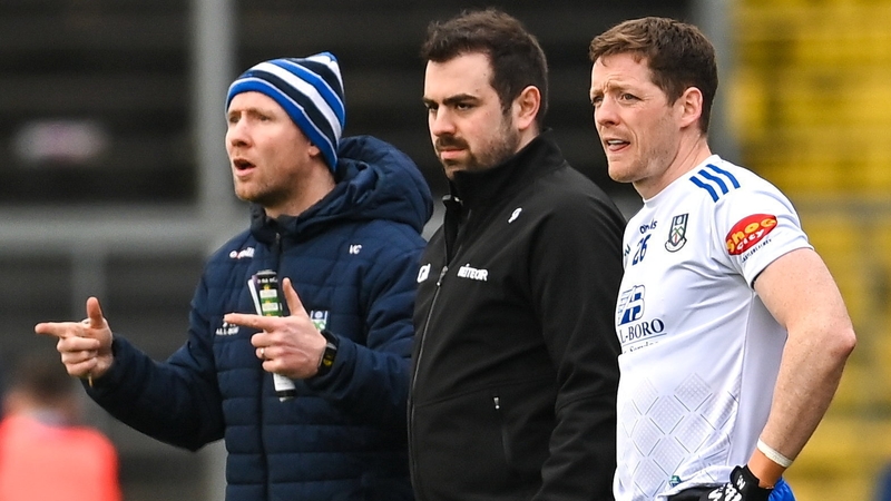 Monaghan manager Vinny Vorey (L) looks on as Conor McManus (R) prepares to enter the fray against Donegal