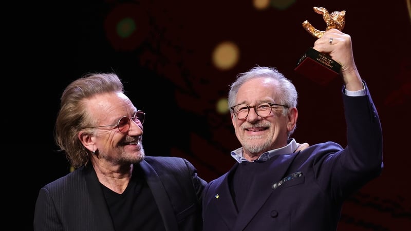 This one's for you! Bono presents the award to Steven Spielberg