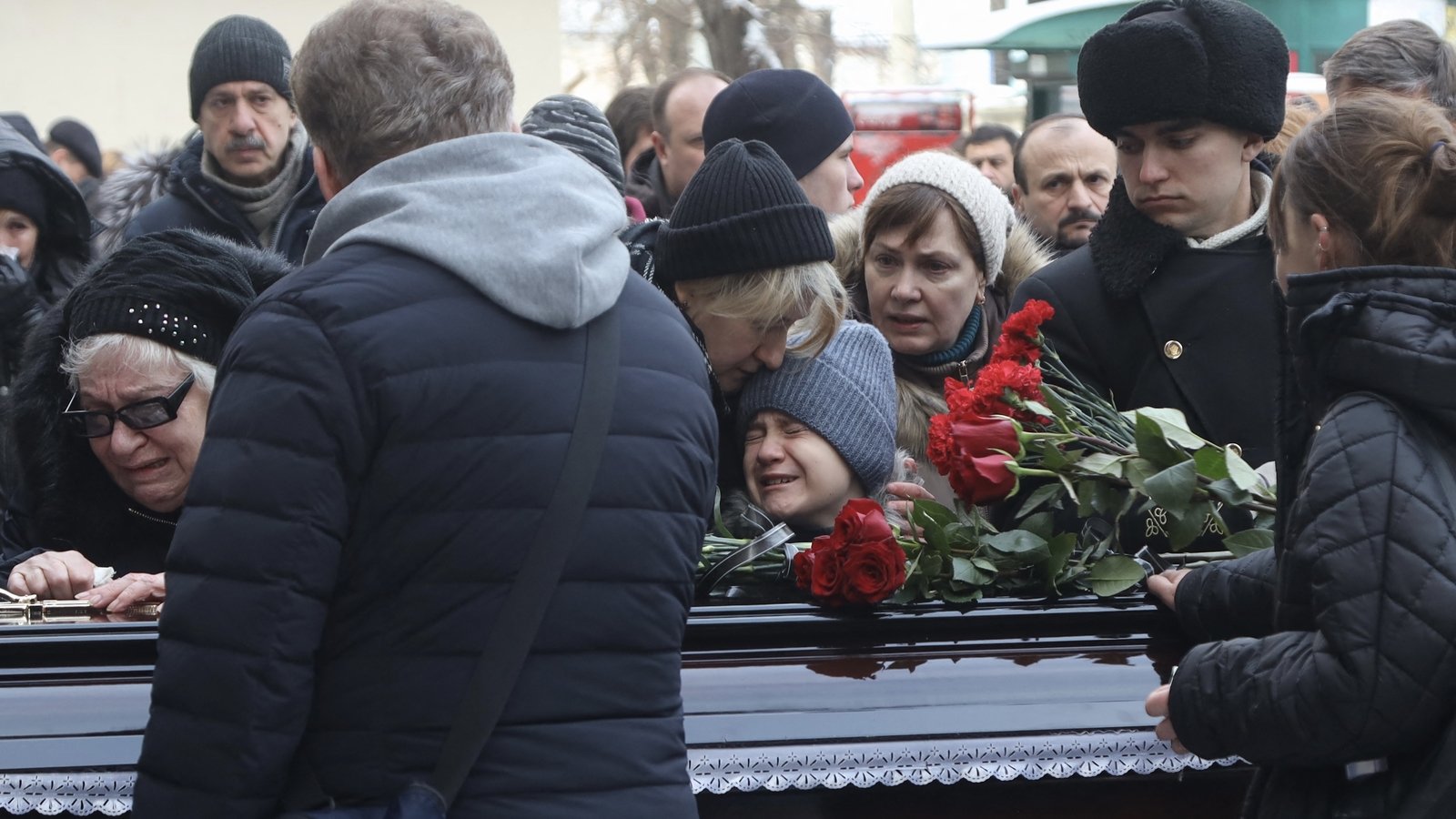 Relatives grieve over the coffin of Ukrainian sub lieutenant, former journalist and writer Ihor Teryokhin, who died near the city of Kherson in January 2023.