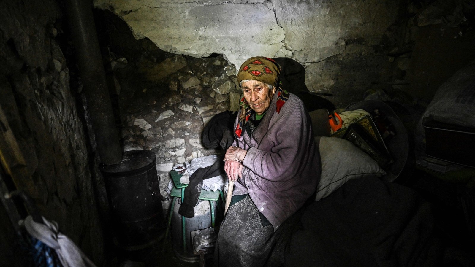 Nina Gonchar sits on a bed inside a bunker in Bohorodychne village in Kramatorsk, Donetsk region, on 13 September 2022.