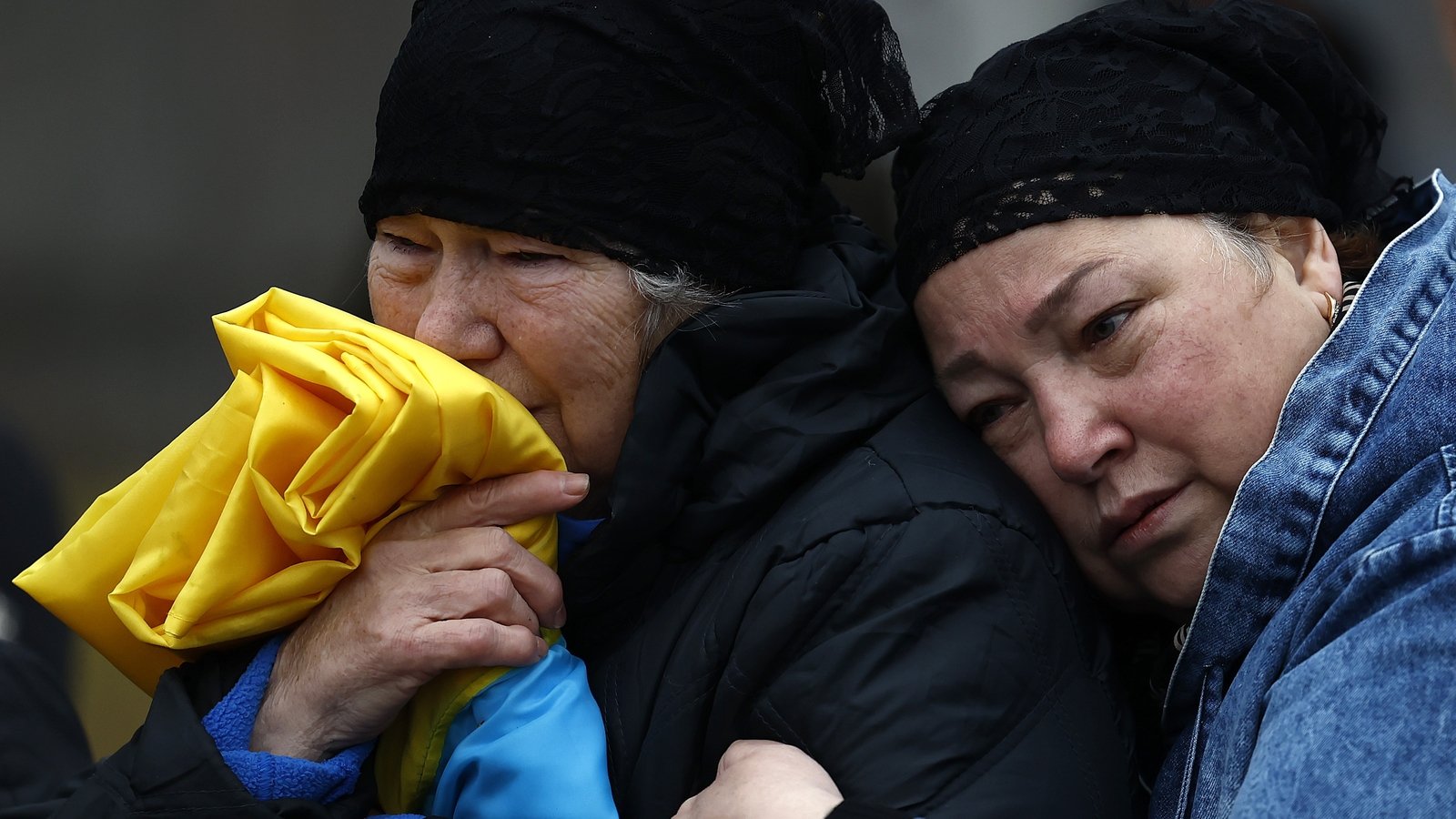 Family members grieve during the funeral of 44-year-old Maksym Kropyva, killed in action in Kykolaiv on 8 November