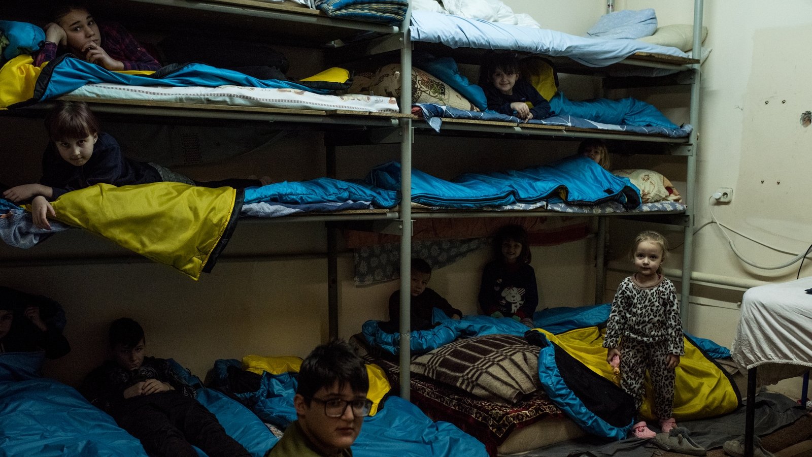 Children hide at a bomb shelter during air raid siren on 17 January 2023 in Zaporizhzhia.