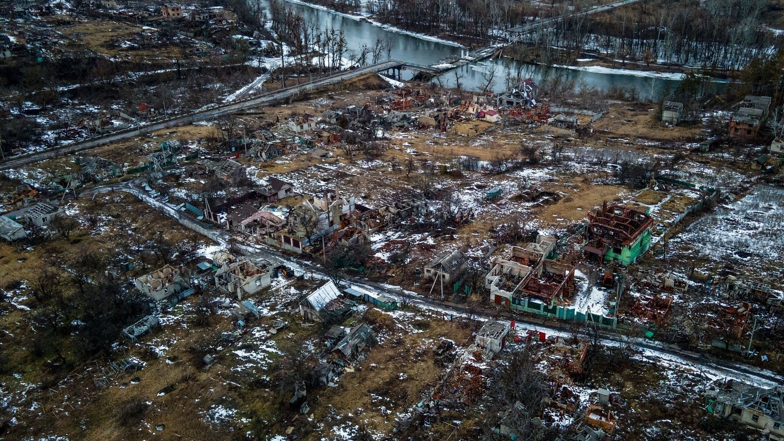 An aerial photograph shows destroyed residential buildings in the village of Bohorodychne, Donetsk region.