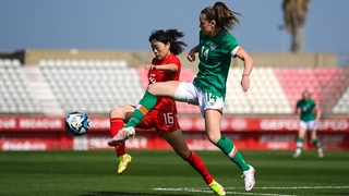 Heather Payne battles for possession against China PR's Yao Lingwei