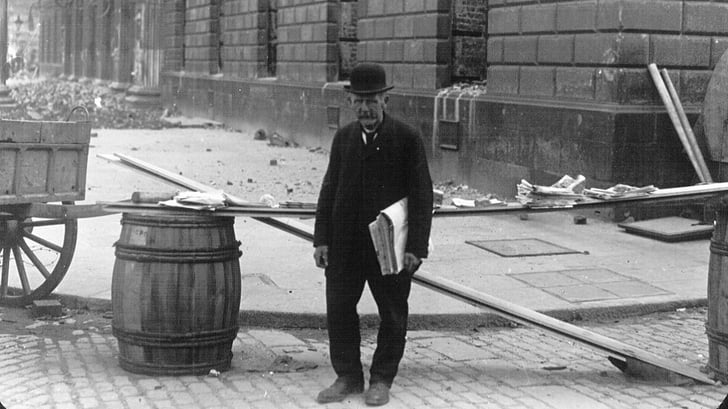 Newspaper vendor after Easter Rising (1916) Murtagh Collection